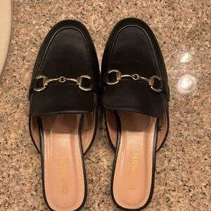 Gusminiara Black Leather Mules with Gold Accent